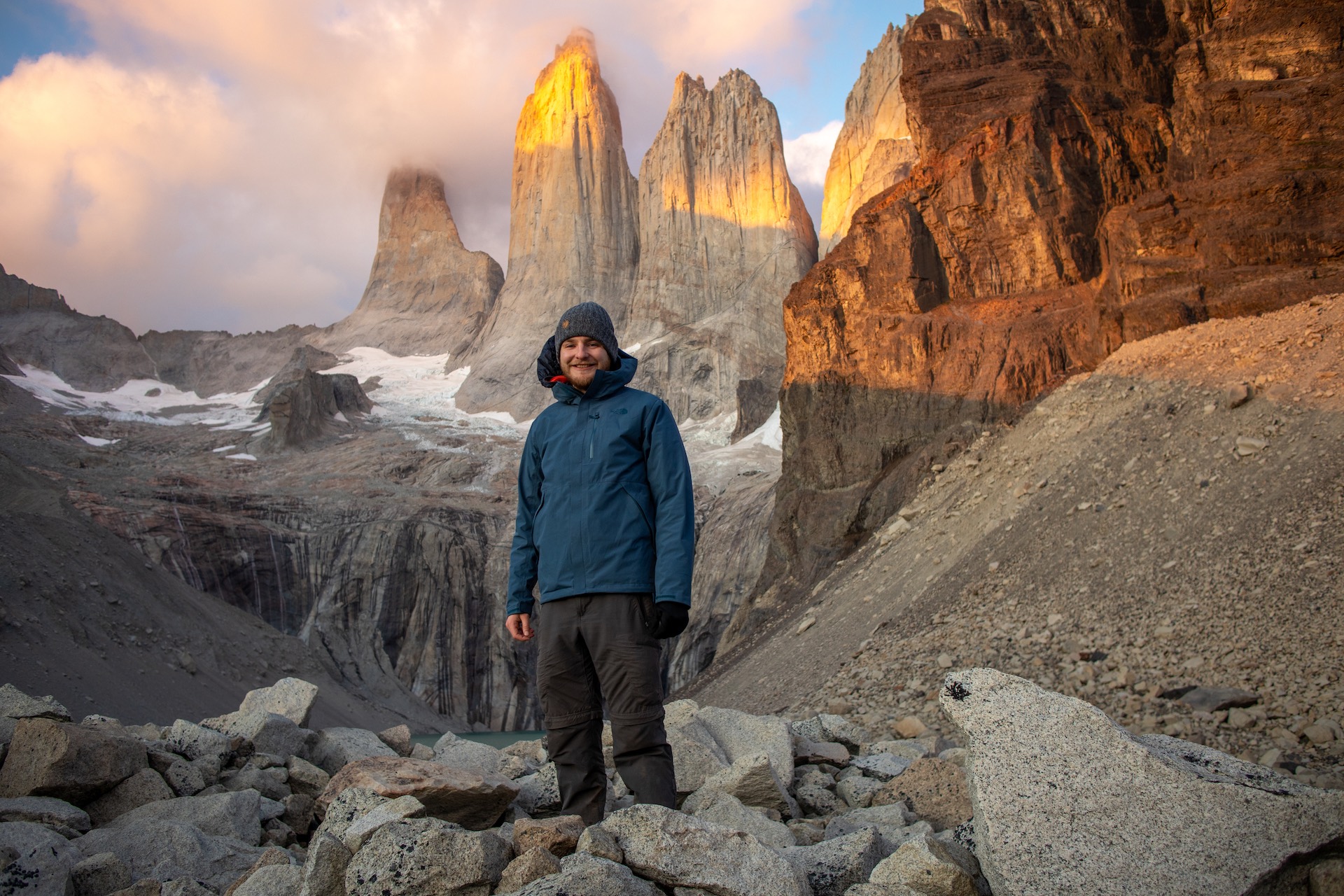 Photo of the author in
					front of Las Torres del Paine in Chile